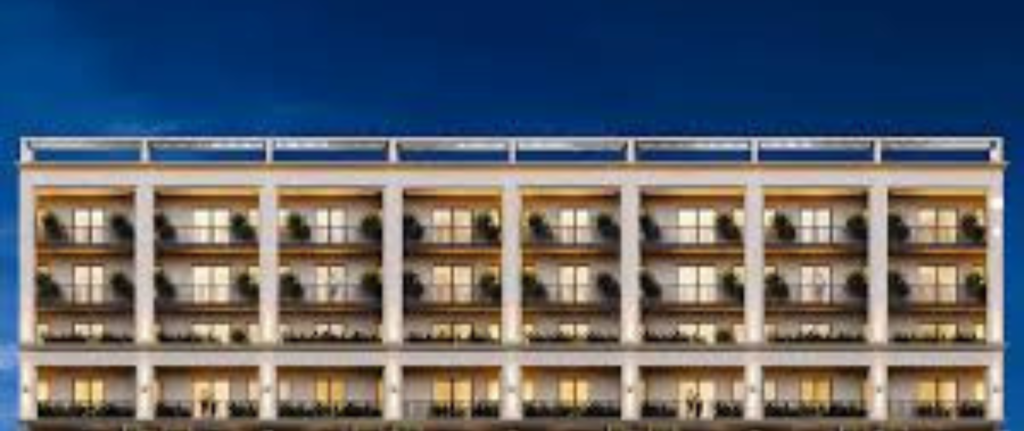 “Modern residential apartment building in Greater Noida West by AMBR HOMES”